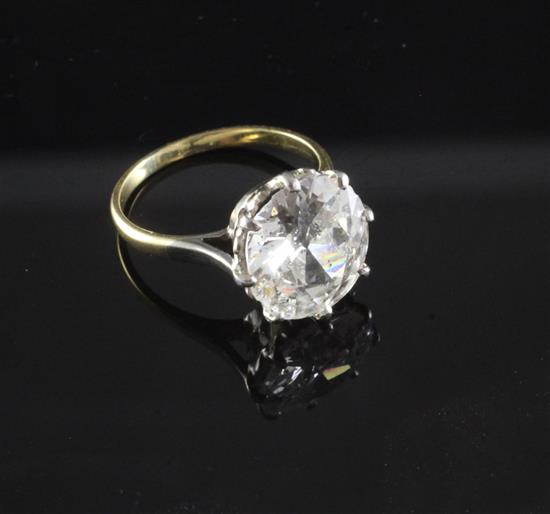 A gold, platinum and solitaire diamond ring, size K/L.